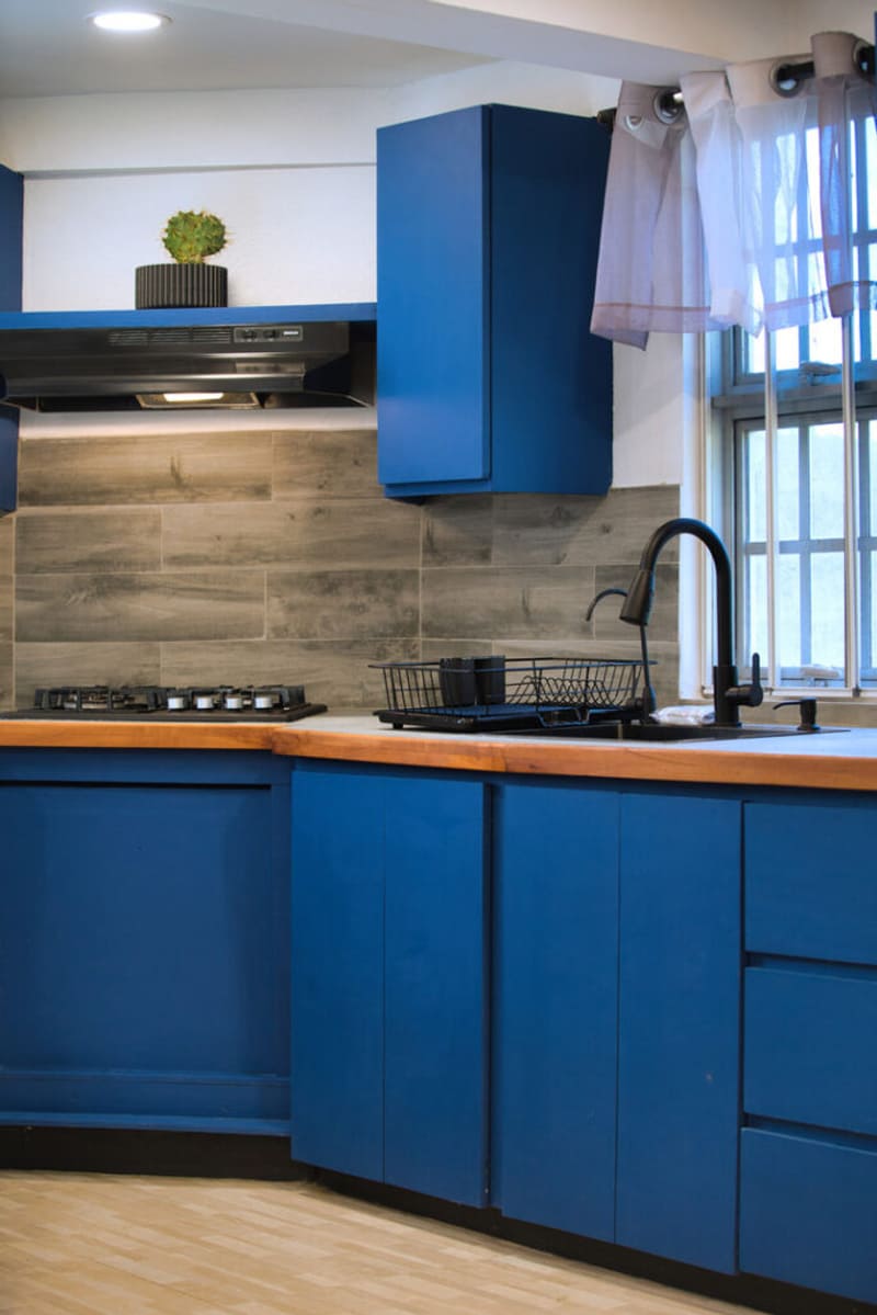 Kitchen at Il Blu Apartment with cabinetry and cooking facilities