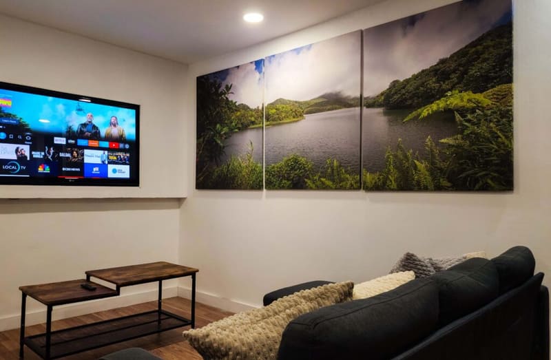 Living area at Il Blu Apartment with a sofa, coffee table and smart TV